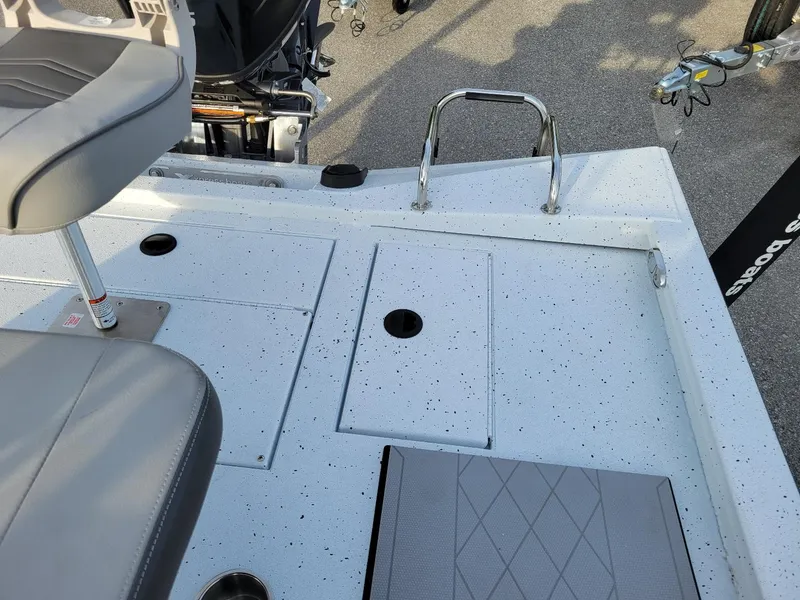 Slide: The Image of 2025 Xpress H190 Bay Boat deck with seating and storage compartments. - 9