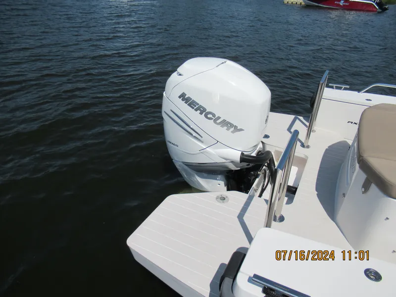 Slide: The Image of 2018 Axopar Mark II boat with Mercury outboard motor on water. - 18