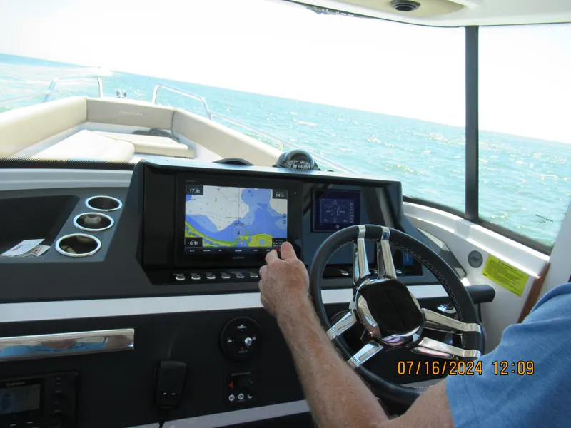 Slide: The Image of 2018 Axopar Mark II boat dashboard with navigation system on open water. - 19