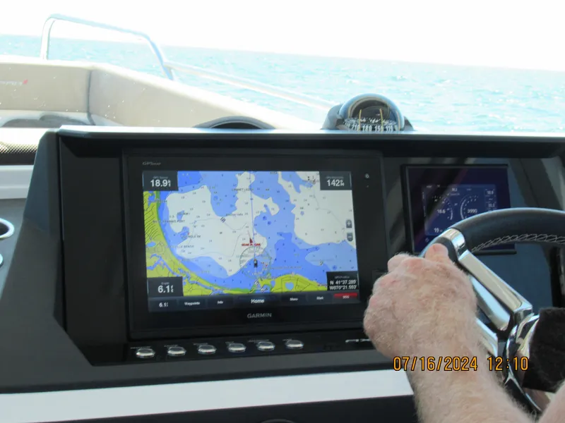 Slide: The Image of 2018 Axopar Mark II boat navigation system with Garmin display on open water. - 20