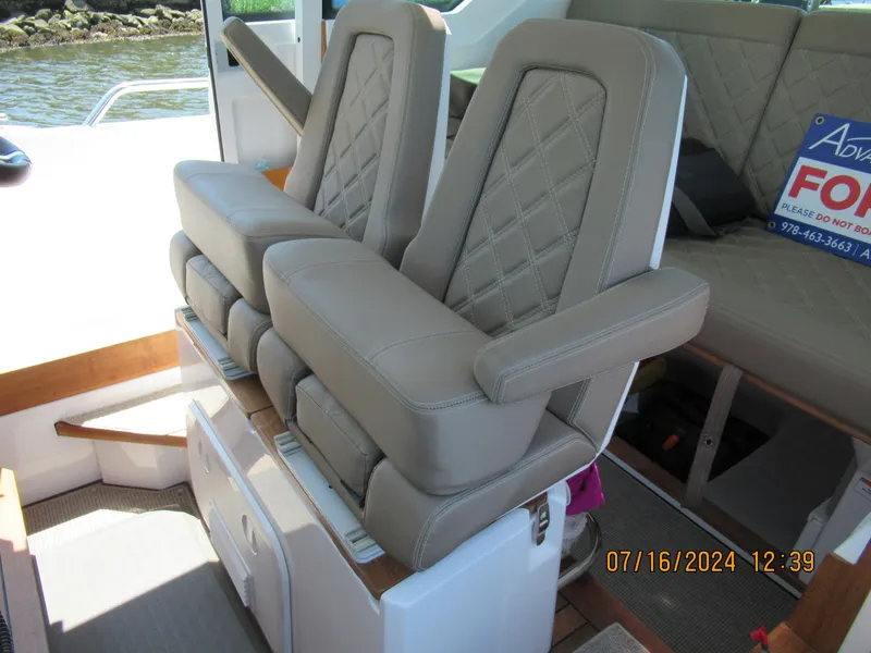 Slide: The Image of Luxurious seating on 2018 Axopar Mark II boat with diamond-stitched upholstery. - 28