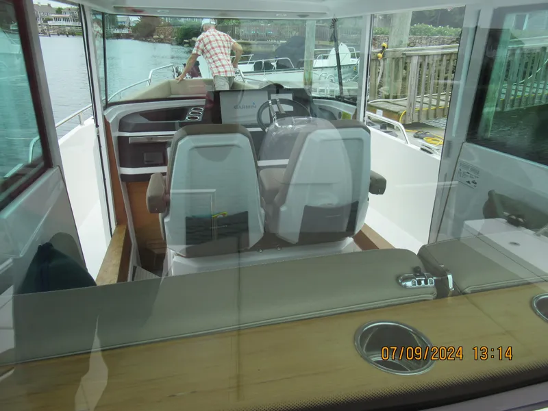 Slide: The Image of Interior view of 2018 Axopar Mark II boat with modern seating and dashboard. - 31