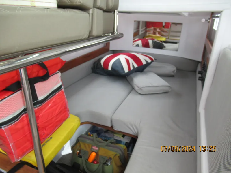 Slide: The Image of Interior cabin of 2018 Axopar Mark II with cushions and storage bags. - 32