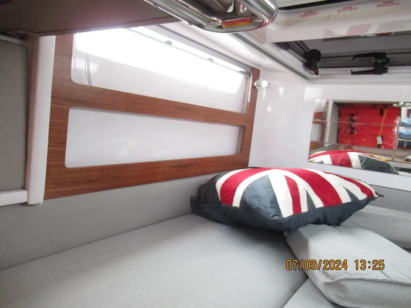 Slide: The Image of Interior of 2018 Axopar Mark II with Union Jack pillow and modern design. - 33