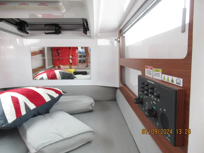 Slide: The Image of Interior cabin of 2018 Axopar Mark II with control panel and Union Jack pillow. - 34