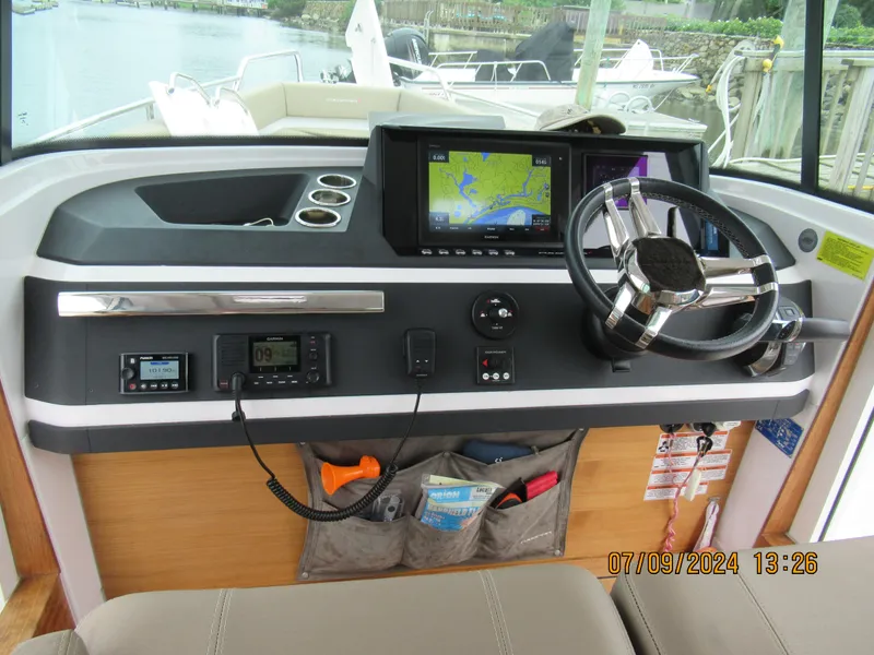 Slide: The Image of 2018 Axopar Mark II helm with navigation system and steering wheel. - 36