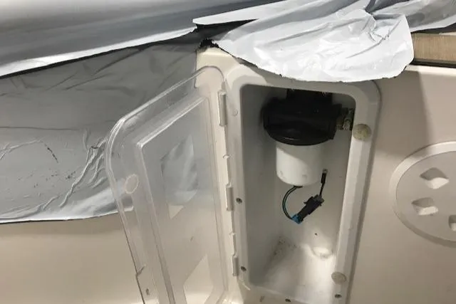 Slide: The Image of Axopar Mark II 2018 boat compartment with open hatch and visible wiring. - 6