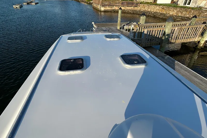 Slide: The Image of Axopar Mark II 2018 boat docked by wooden pier on a sunny day. - 7