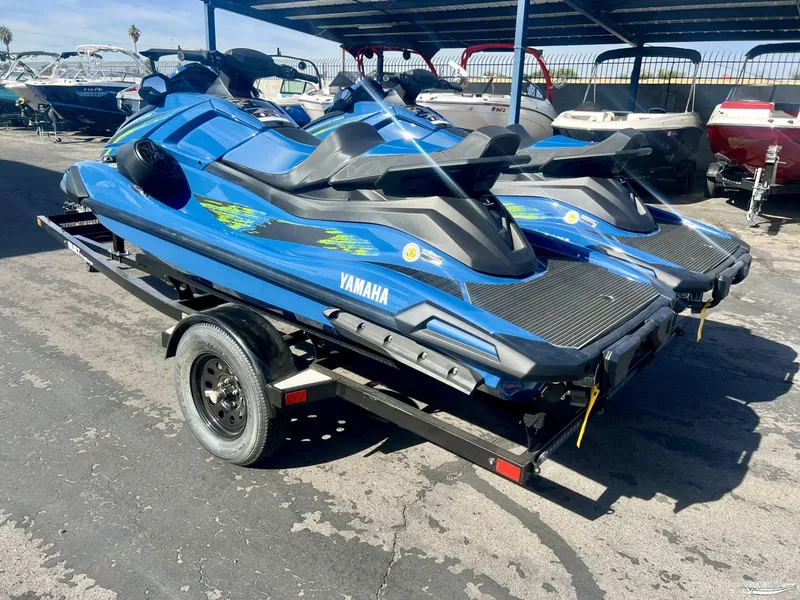 Slide: The Image of 2025 Yamaha WaveRunner VX Cruiser HO with Audio on trailer in marina. - 1