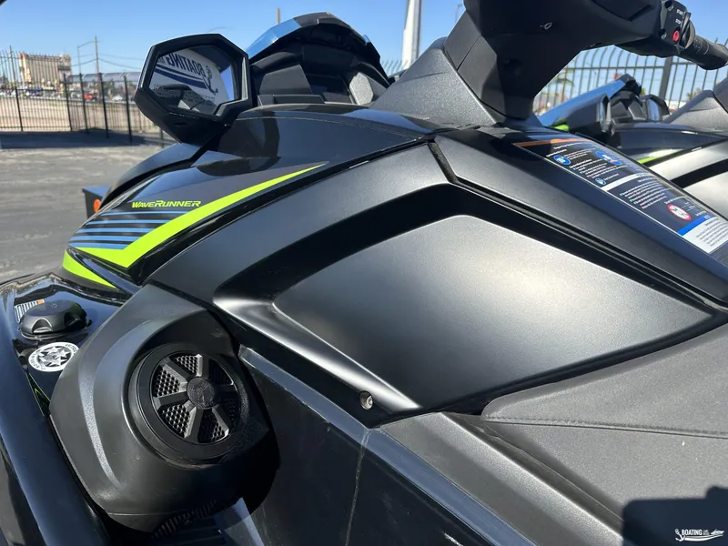 Slide: The Image of 2024 Yamaha WaveRunner VX Deluxe, sleek black design with vibrant green accents. - 7