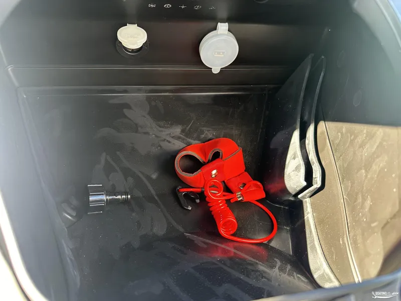 Slide: The Image of 2024 Yamaha WaveRunner VX Deluxe storage compartment with red safety lanyard. - 9