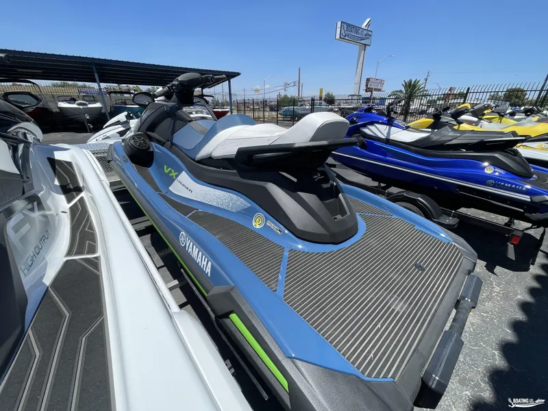Slide: The Image of 2024 Yamaha WaveRunner VX Cruiser w/Audio in blue, displayed at a dealership. - 3
