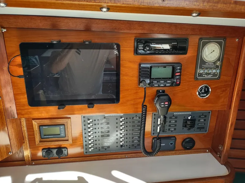 Slide: The Image of Control panel of a 1983 Islander 40 sailboat with navigation and communication equipment. - 31