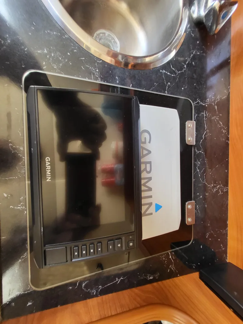 Slide: The Image of Garmin device on Rinker Fiesta Vee 270 boat's countertop, near sink, 2003 model. - 21
