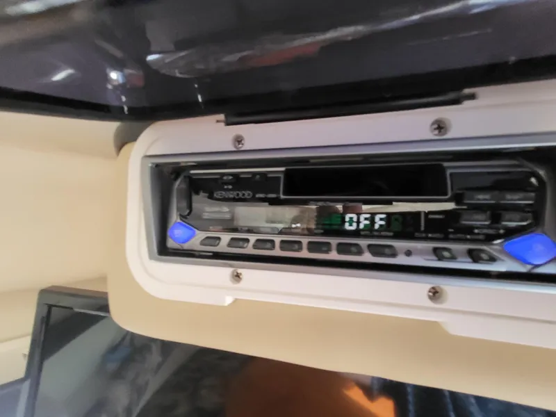 Slide: The Image of Kenwood stereo system in 2003 Rinker Fiesta Vee 270 boat interior. - 24