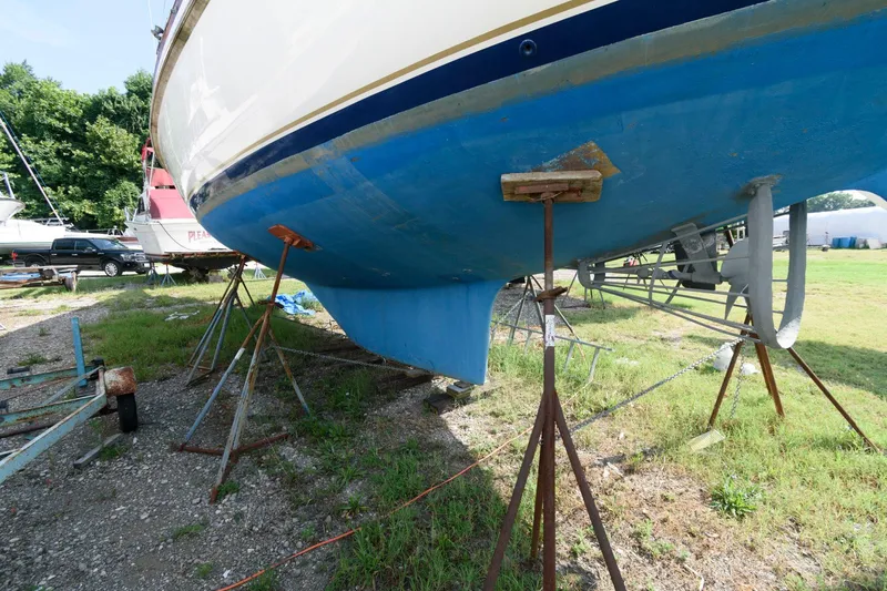 Slide: The Image of 1977 Gulfstar 50 Center Cockpit sailboat on stands for maintenance. - 4