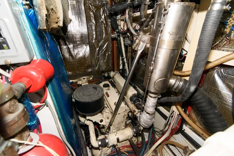 Slide: The Image of Engine room of a 1977 Gulfstar 50 Center Cockpit sailboat with various mechanical components. - 41