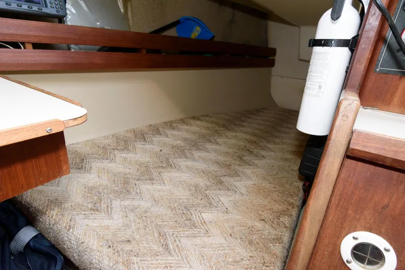 Slide: The Image of Interior cabin of a 1983 O'Day 30 sailboat with a cozy sleeping berth. - 14