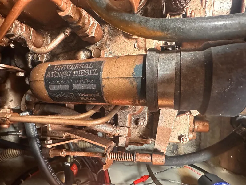 Slide: The Image of Close-up of a Universal Atomic Diesel engine in a 1983 O'Day 30 sailboat. - 18
