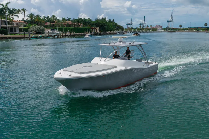 Slide: The Image of 2010 Buddy Davis 35 Predator cruising on a scenic waterway. - 2
