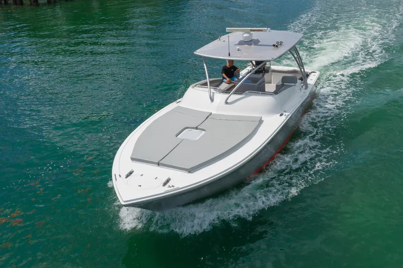 Slide: The Image of 2010 Buddy Davis 35 Predator cruising on clear water. - 3