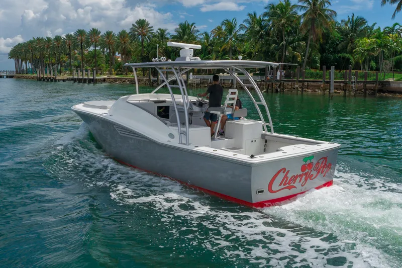 Slide: The Image of 2010 Buddy Davis 35 Predator boat cruising in tropical waters. - 4