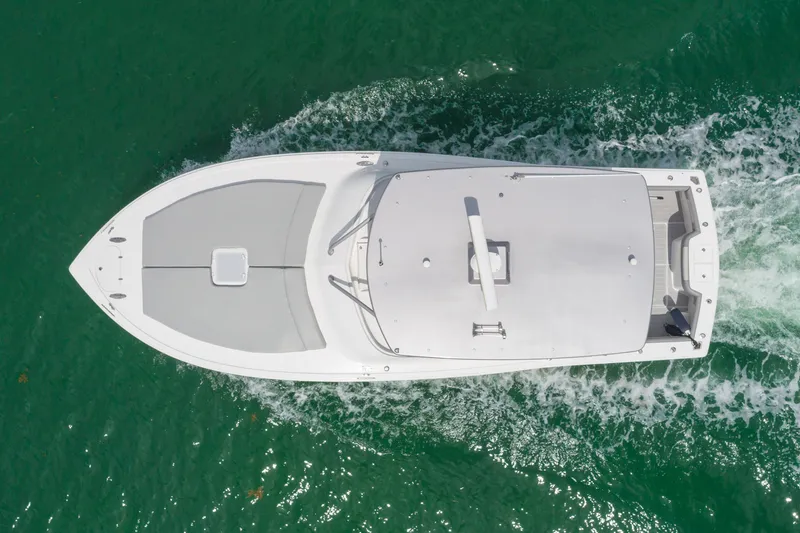 Slide: The Image of Aerial view of 2010 Buddy Davis 35 Predator boat cruising on green water. - 6