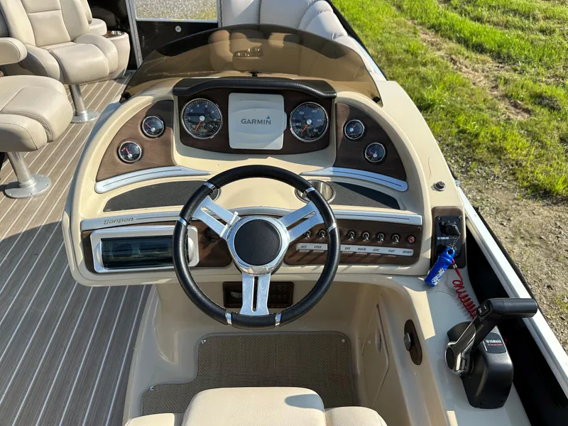 Slide: The Image of Sanpan SP2200BC3 2014 boat console with Garmin GPS and controls. - 13