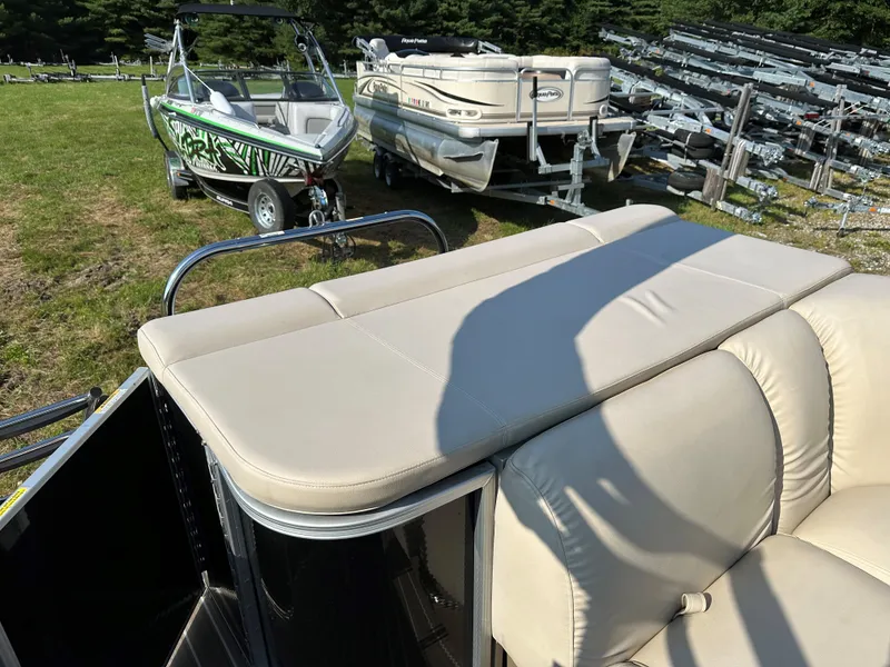 Slide: The Image of Sanpan SP2200BC3 pontoon boat, 2014, with beige upholstery, parked outdoors. - 5