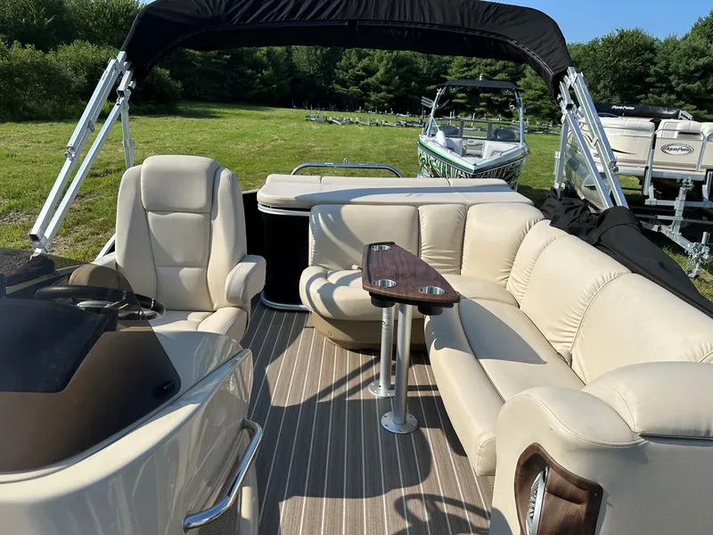 Slide: The Image of Sanpan SP2200BC3 2014 pontoon boat with beige seating outdoors. - 6