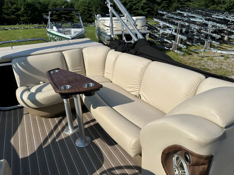 Slide: The Image of Sanpan SP2200BC3 2014 with beige sofa and wooden table on deck. - 8