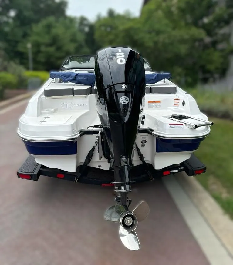 Slide: The Image of 2024 Tahoe 200 S boat with 150 HP outboard motor on trailer. - 3