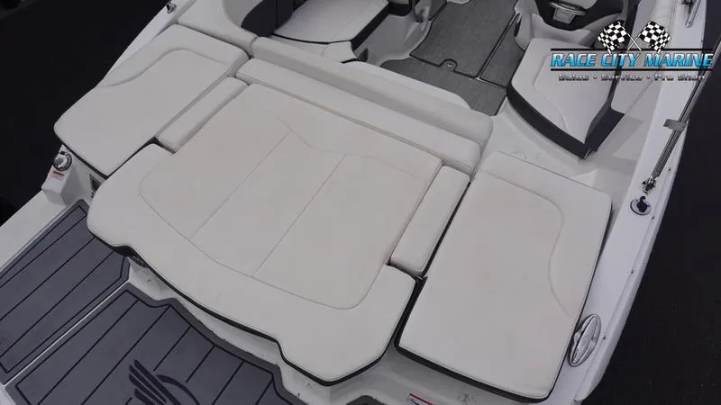 Slide: The Image of 2020 Chaparral 237 SSX boat with spacious rear seating and Race City Marine logo. - 13