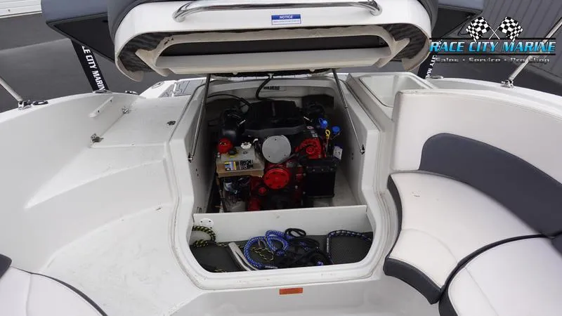 Slide: The Image of 2020 Chaparral 237 SSX boat engine compartment with open hatch. - 15