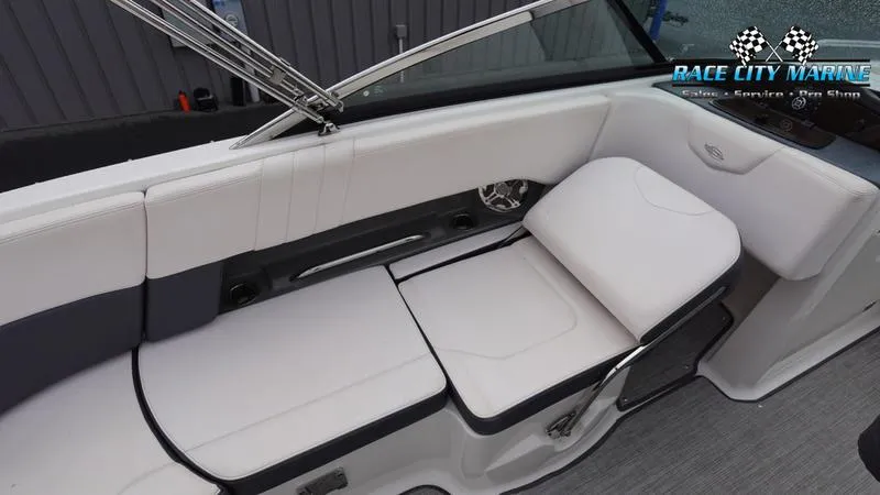 Slide: The Image of 2020 Chaparral 237 SSX boat interior with white cushioned seating. - 16
