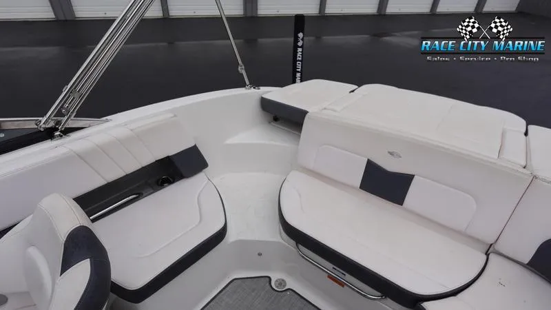 Slide: The Image of 2020 Chaparral 237 SSX boat interior with white and black seating, Race City Marine logo. - 18