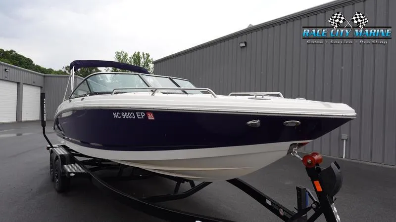 Slide: The Image of 2020 Chaparral 237 SSX boat on trailer at Race City Marine dealership. - 2