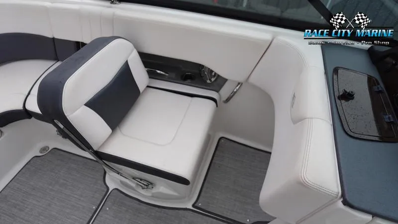 Slide: The Image of 2020 Chaparral 237 SSX boat interior with white and gray seating. - 22
