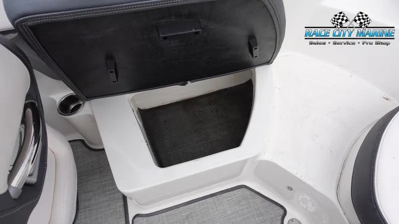 Slide: The Image of Open storage compartment in a 2020 Chaparral 237 SSX boat by Race City Marine. - 24