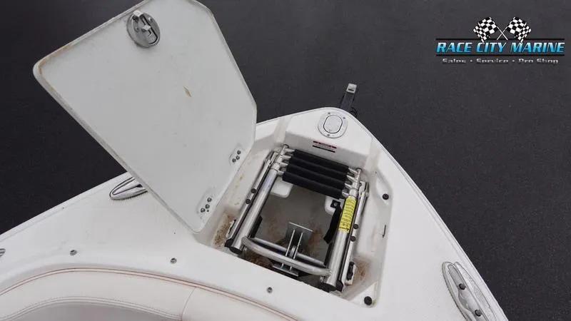 Slide: The Image of 2020 Chaparral 237 SSX boat with open anchor storage compartment. - 29