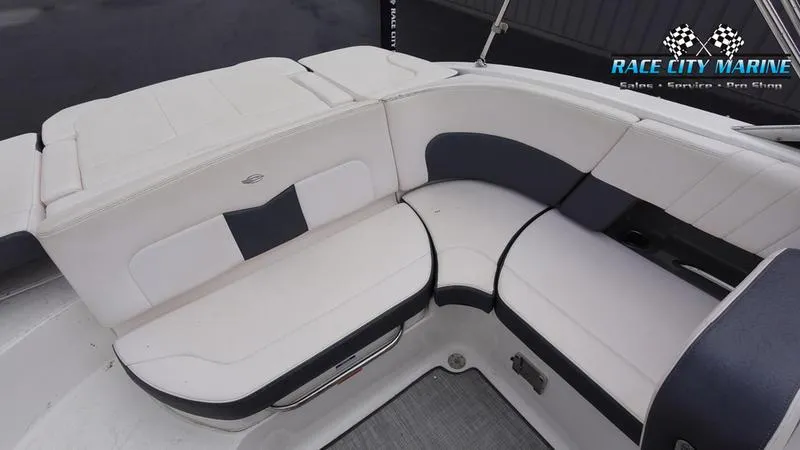 Slide: The Image of 2020 Chaparral 237 SSX boat interior with white and navy seating. - 30