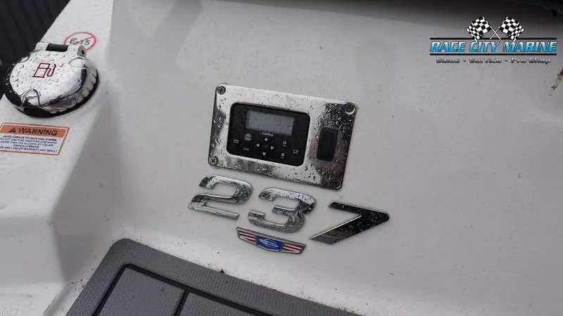 Slide: The Image of 2020 Chaparral 237 SSX boat dashboard with Race City Marine logo. - 31