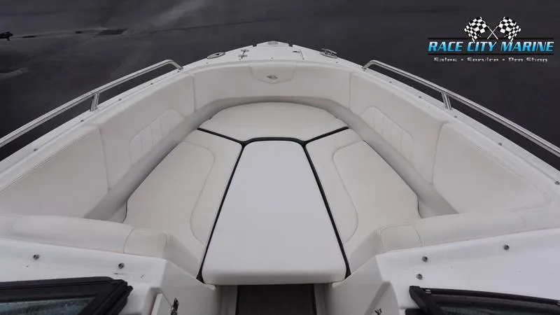 Slide: The Image of 2020 Chaparral 237 SSX boat interior with white cushioned seating. - 34