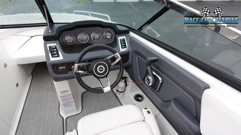 Slide: The Image of 2020 Chaparral 237 SSX boat cockpit with steering wheel and dashboard. - 35