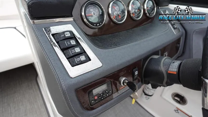 Slide: The Image of Control panel of a 2020 Chaparral 237 SSX boat with gauges and switches. - 36