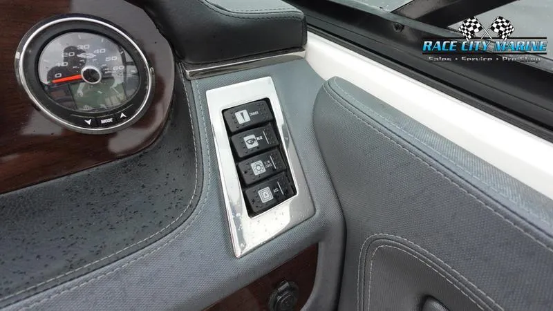 Slide: The Image of Close-up of 2020 Chaparral 237 SSX boat dashboard with control switches. - 37