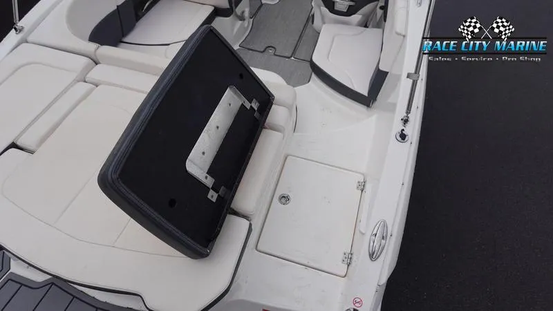 Slide: The Image of 2020 Chaparral 237 SSX boat interior with open storage compartment. - 9