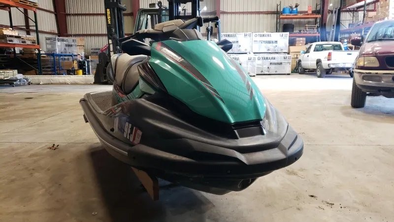Slide: The Image of 2021 Kawasaki STX160X jet ski in a warehouse setting. - 7
