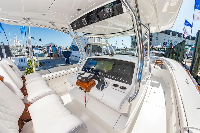 Slide: The Image of 2025 Valhalla Boatworks V-41 interior with modern dashboard and seating. - 11