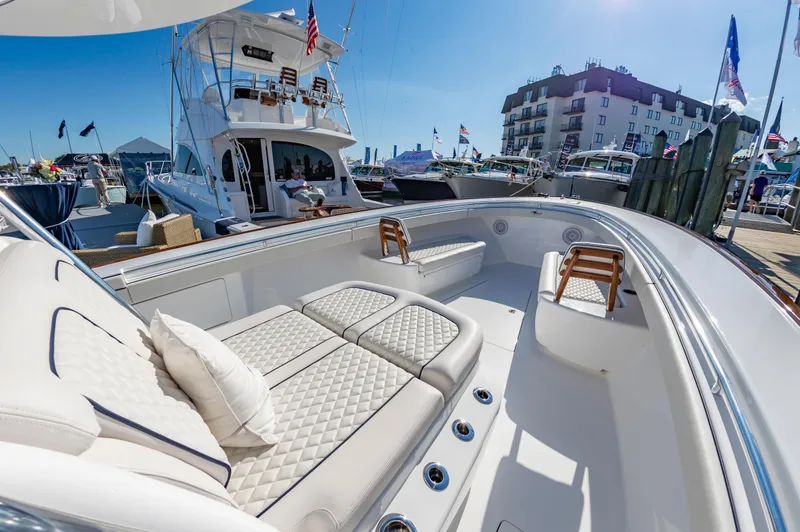 Slide: The Image of 2025 Valhalla Boatworks V-41 luxury yacht interior at marina, featuring plush seating and elegant design. - 15
